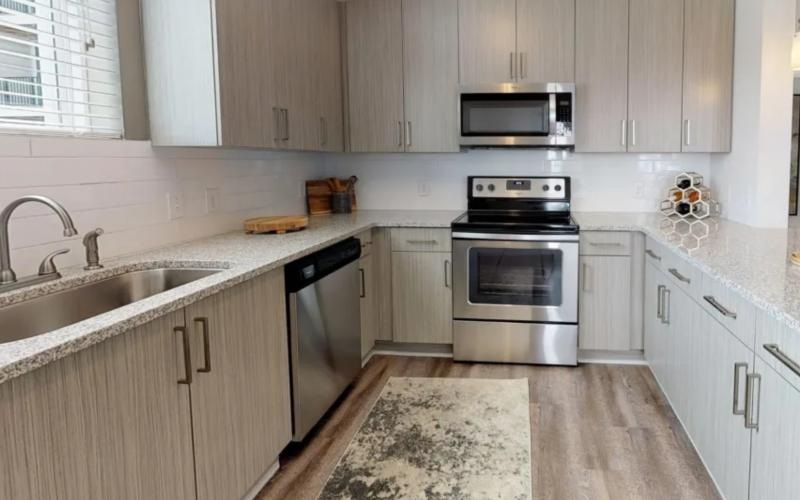 a kitchen with neutral cabinets