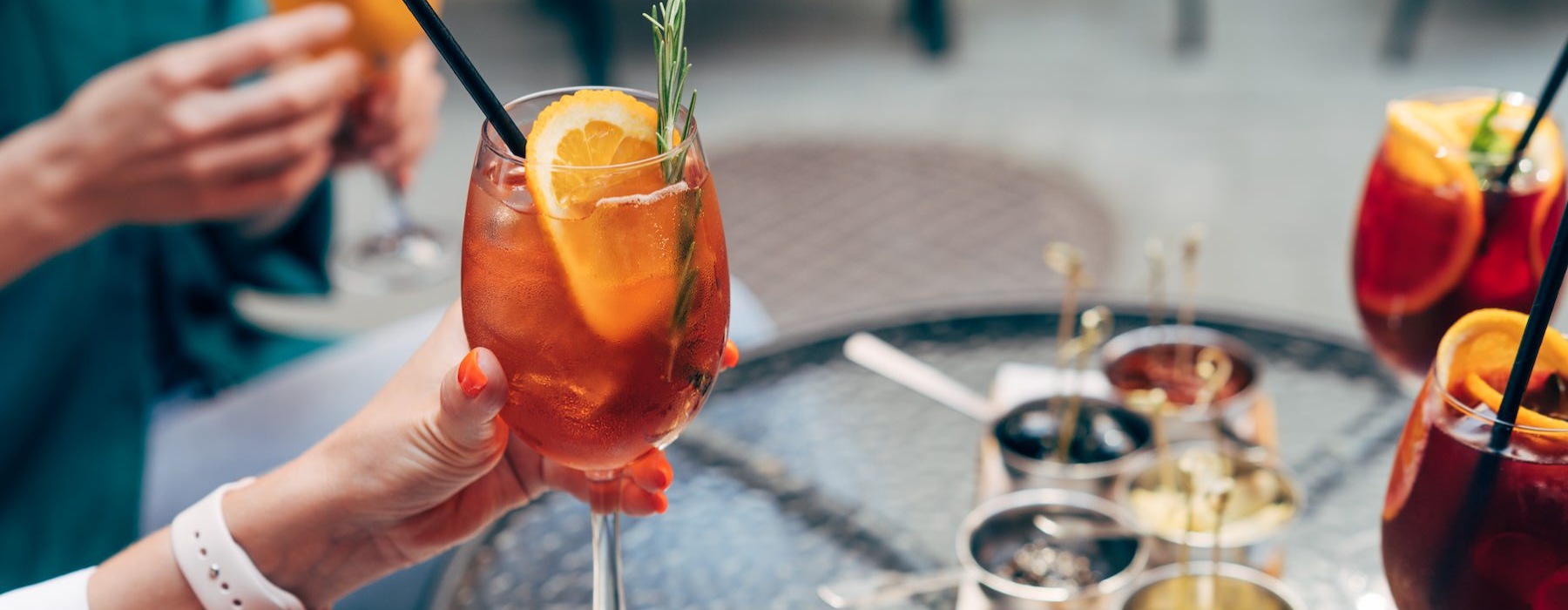 people holding drinks